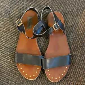 Black Steve Madden sandals with gold accents